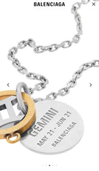 Silver curb chain with round gold tag and engraved inner pendant