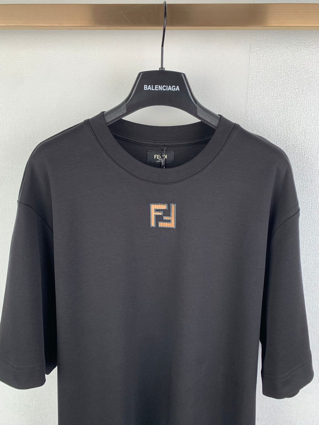 Fendi short-sleeve T-shirt front view with small square logo on chest.