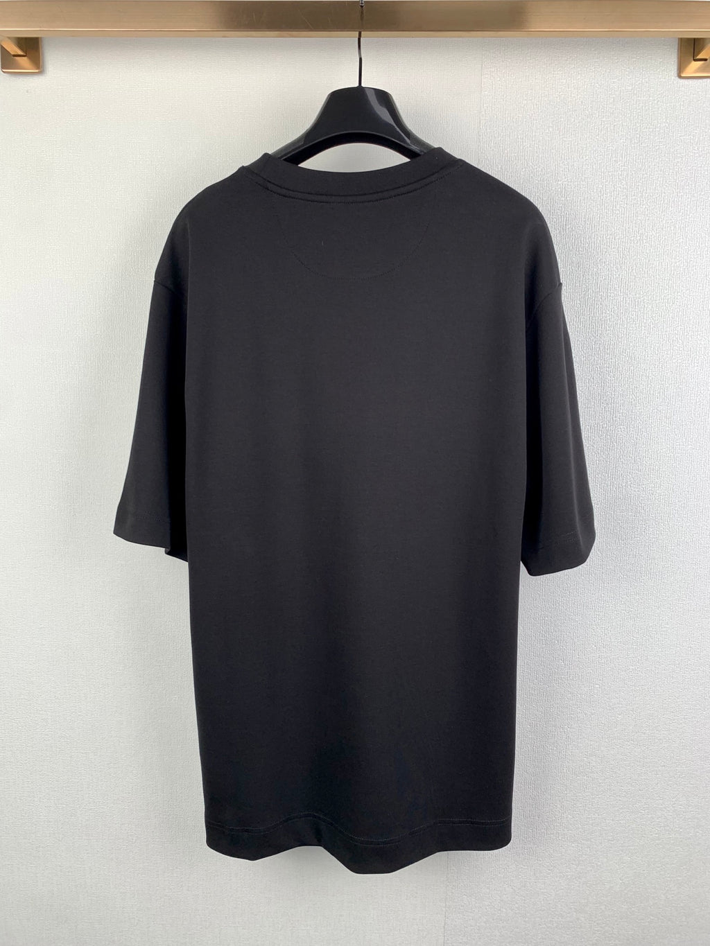 Fendi short-sleeve T-shirt back view, smooth dark gray/black fabric.