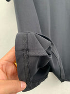Louis Vuitton shorts hem detail, dark gray fabric with stitched edge