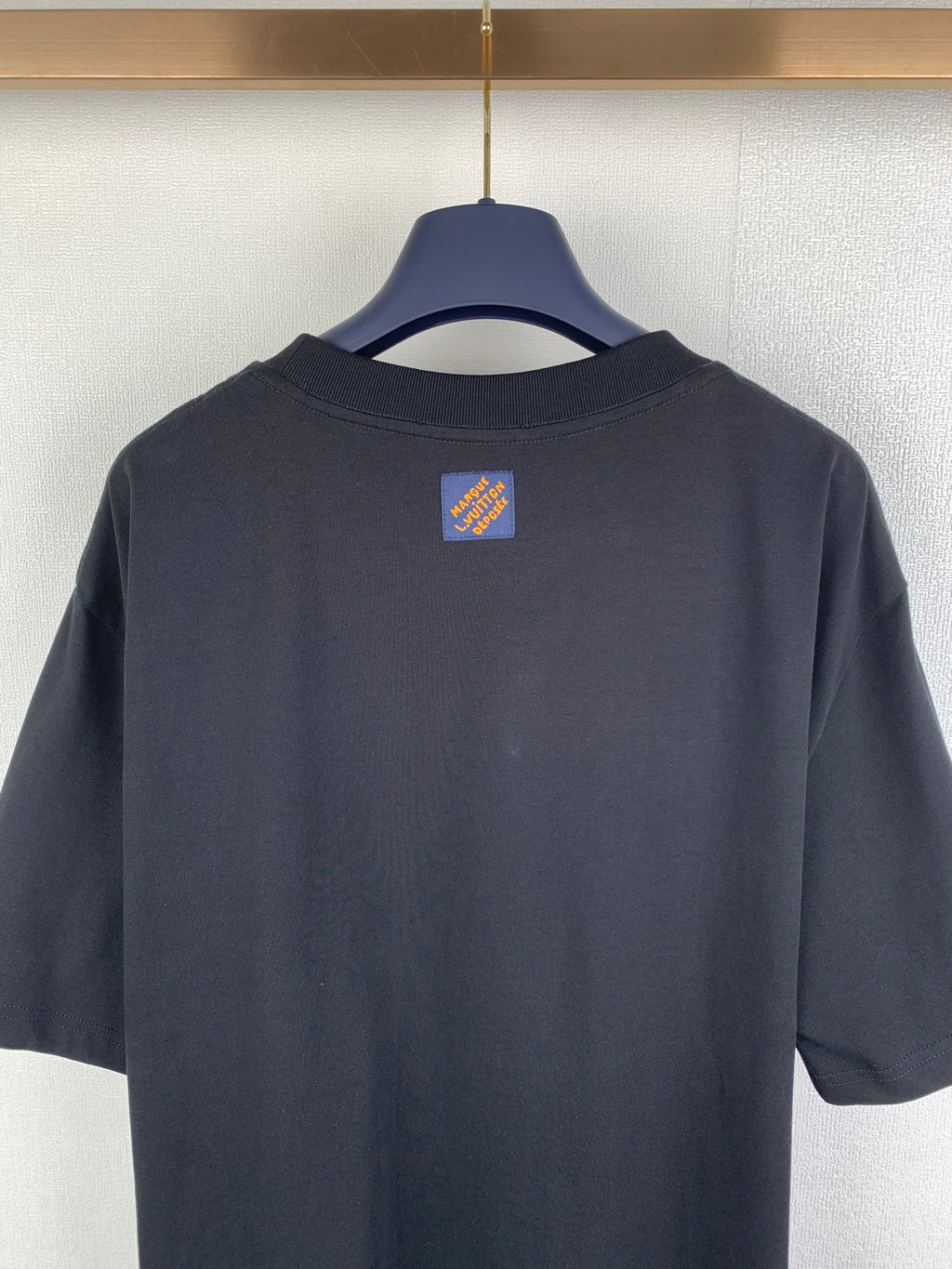 Louis Vuitton dark short-sleeve T-shirt back view with small logo patch