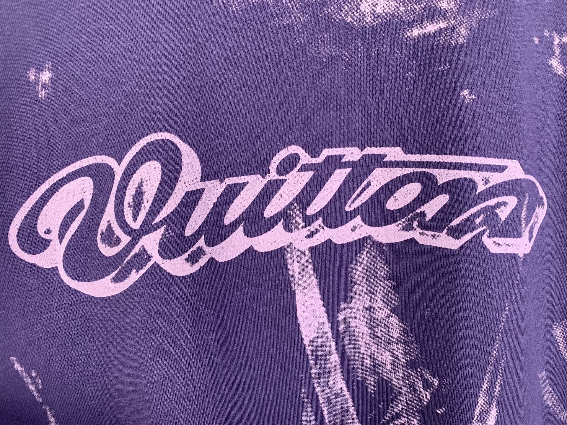 Louis Vuitton purple T-shirt with large script logo graphic