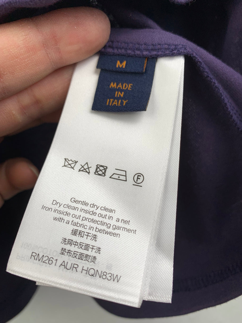 Dark purple shorts with inner care label and size tag