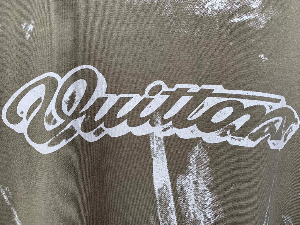 White stylized logo text print on brown T-shirt fabric