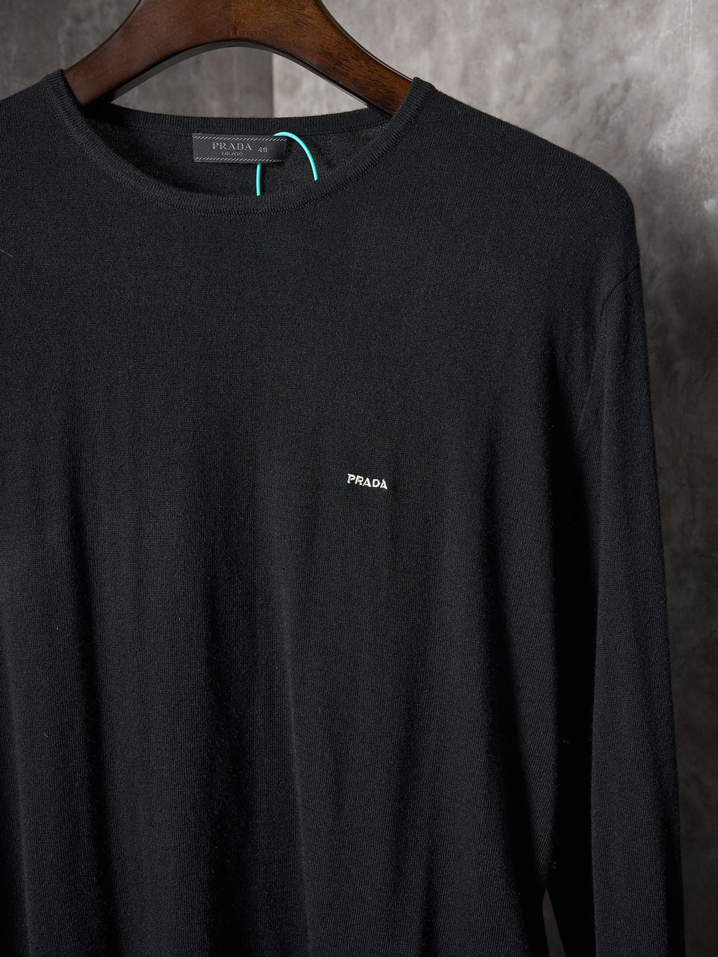 Black crewneck knit sweater with PRADA logo embroidery at chest