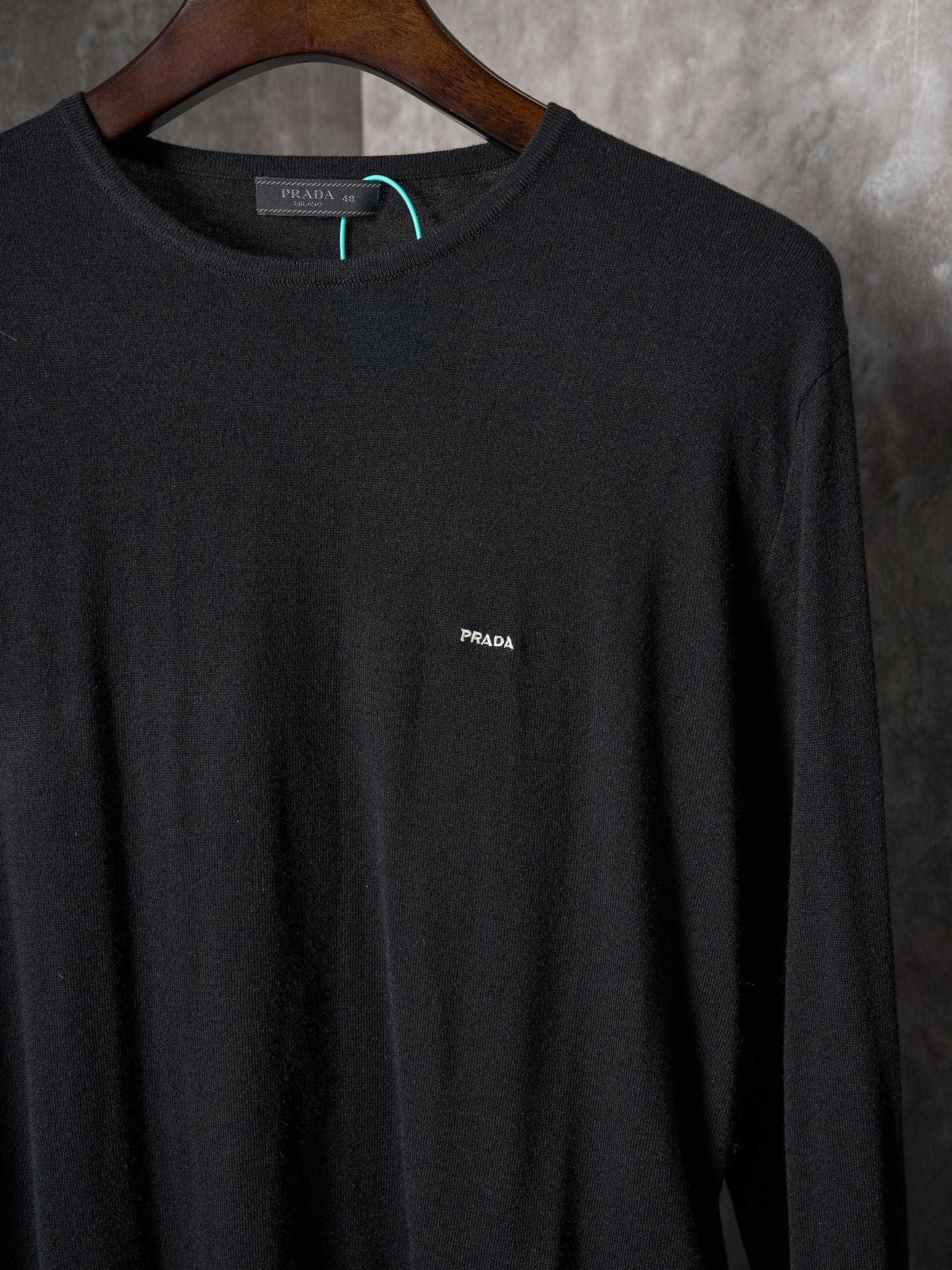 Black crewneck knit sweater with PRADA logo embroidery at chest