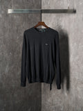 Black crewneck knit sweater with small chest logo detail