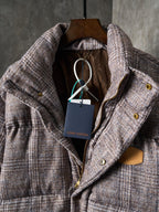 Louis Vuitton long puffer jacket with hood lining and front closure details on hanger