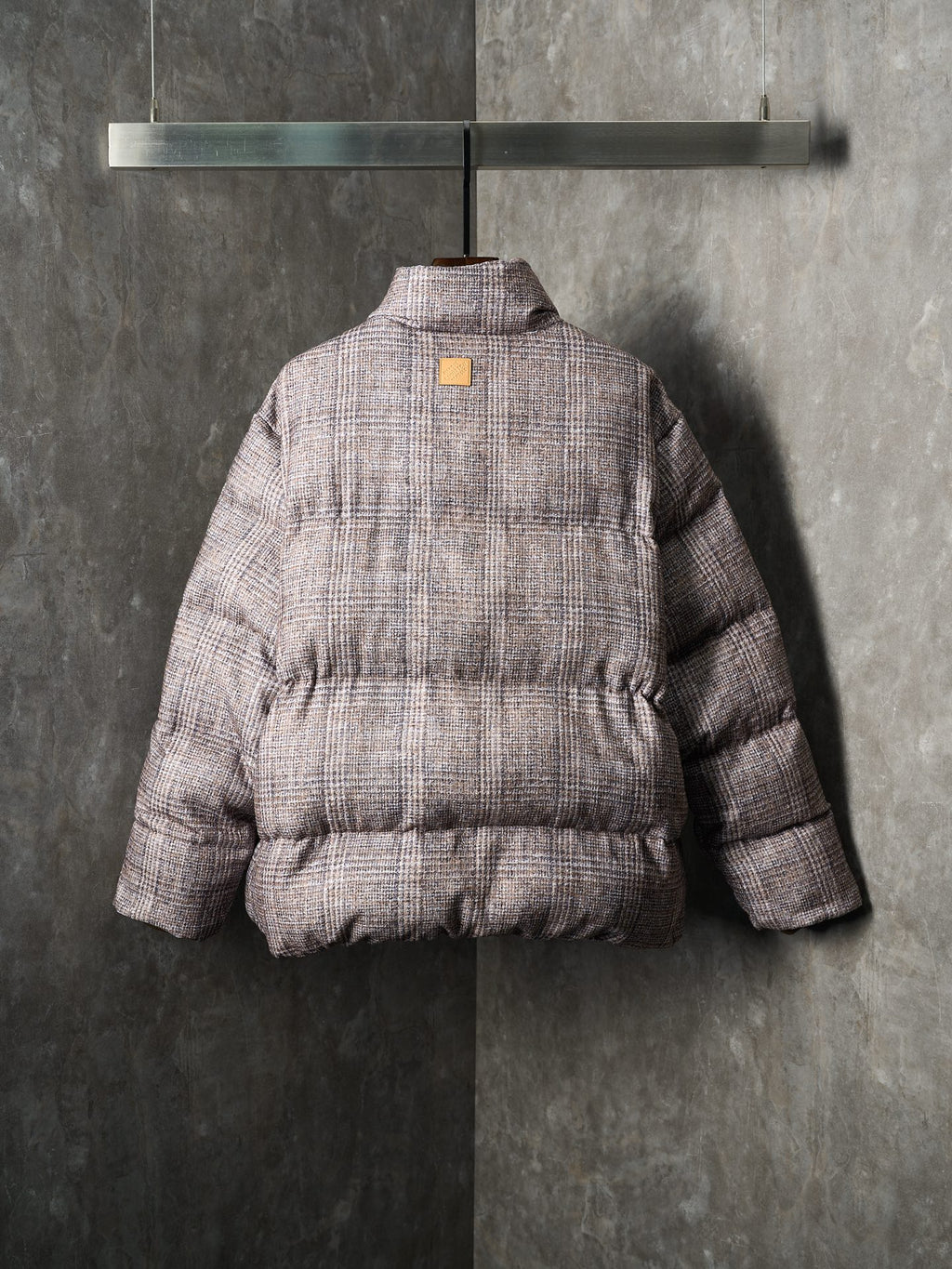 Louis Vuitton long puffer jacket back view with quilted panel and snap closure