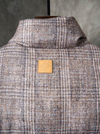 Louis Vuitton long puffer jacket back view with raised collar and tan patch