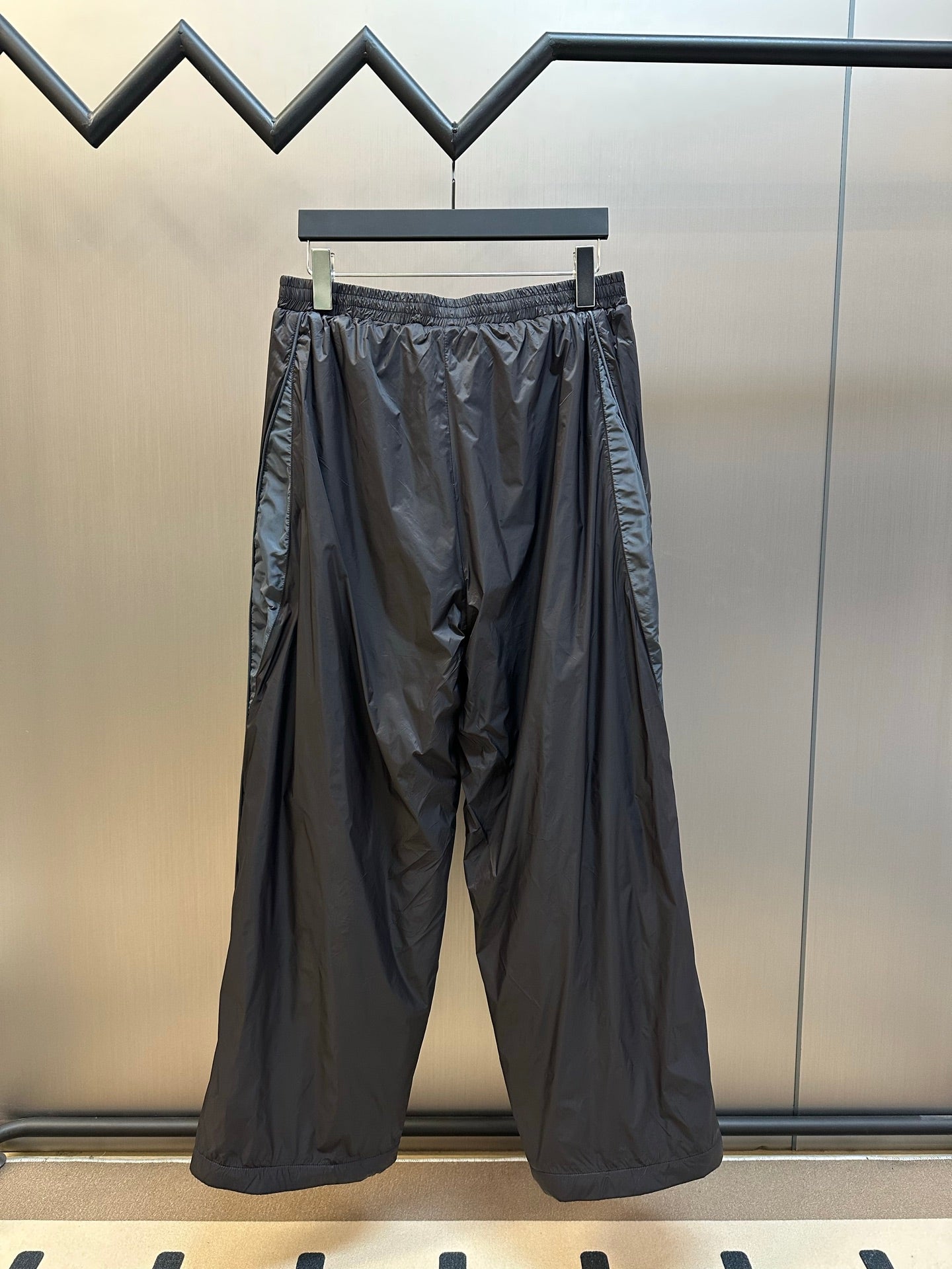 Balenciaga nylon pants, dark navy, relaxed wide leg with elastic waist