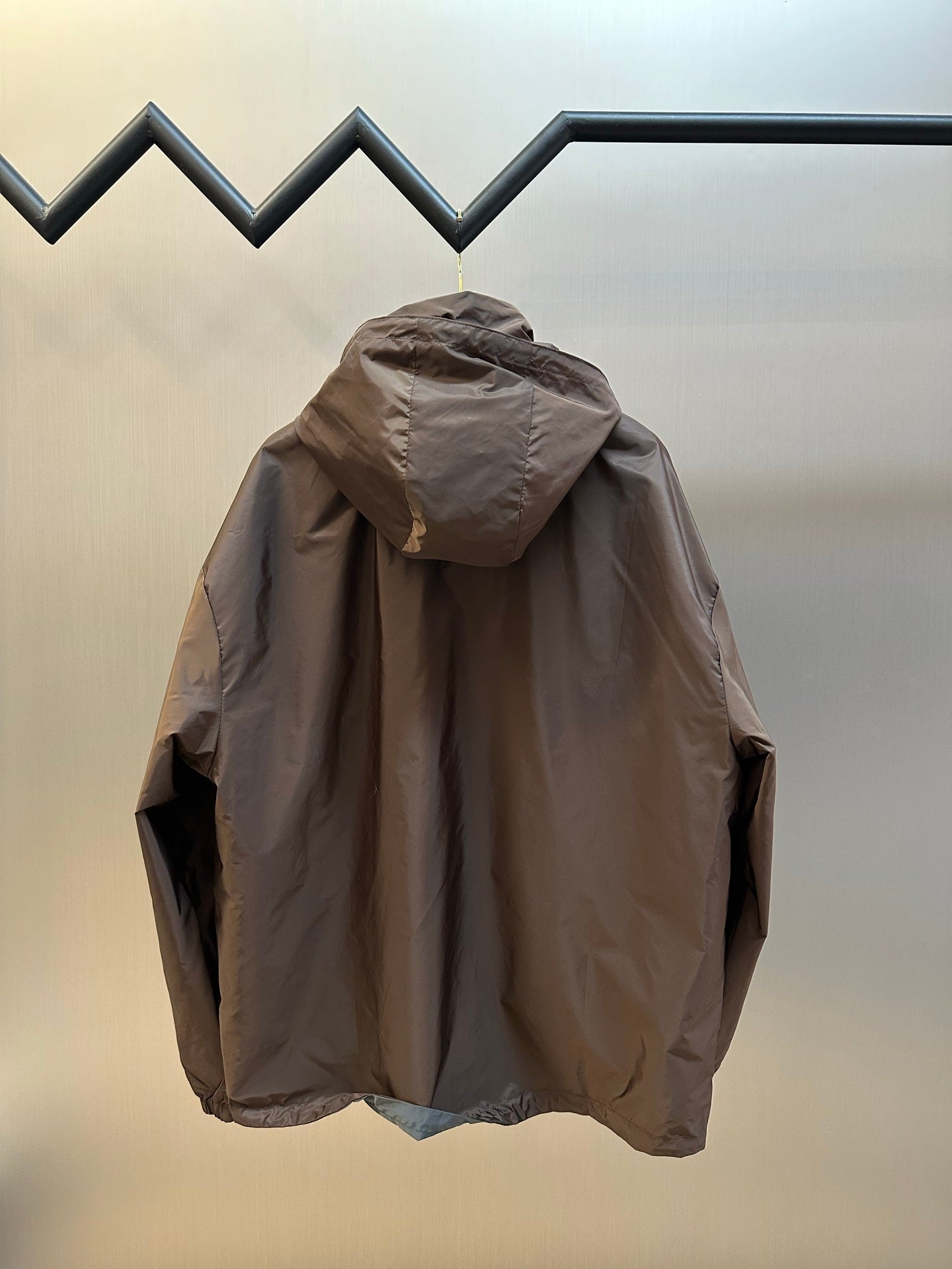 Prada long hooded jacket in dark brown with rear hood detail and shoulder seams