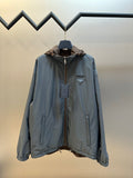Prada long hooded jacket in light blue with full front zipper and flap pockets