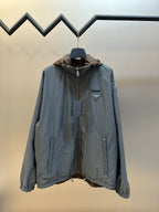 Prada long hooded jacket in light blue with full front zipper and flap pockets