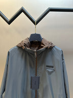 Prada long hooded jacket in light blue with brown hood and chest logo patch