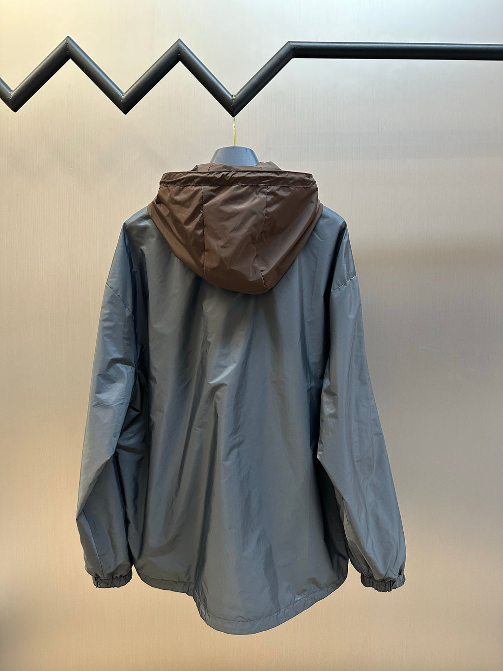 Prada long hooded jacket in light blue with rear view and full buttonless zipper