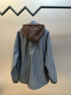 Prada long hooded jacket in light blue with rear view and full buttonless zipper