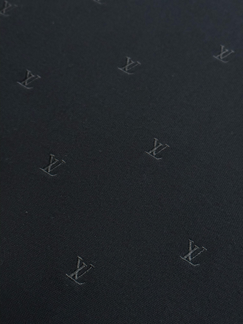 Louis Vuitton dark knit fabric with scattered monogram logos
