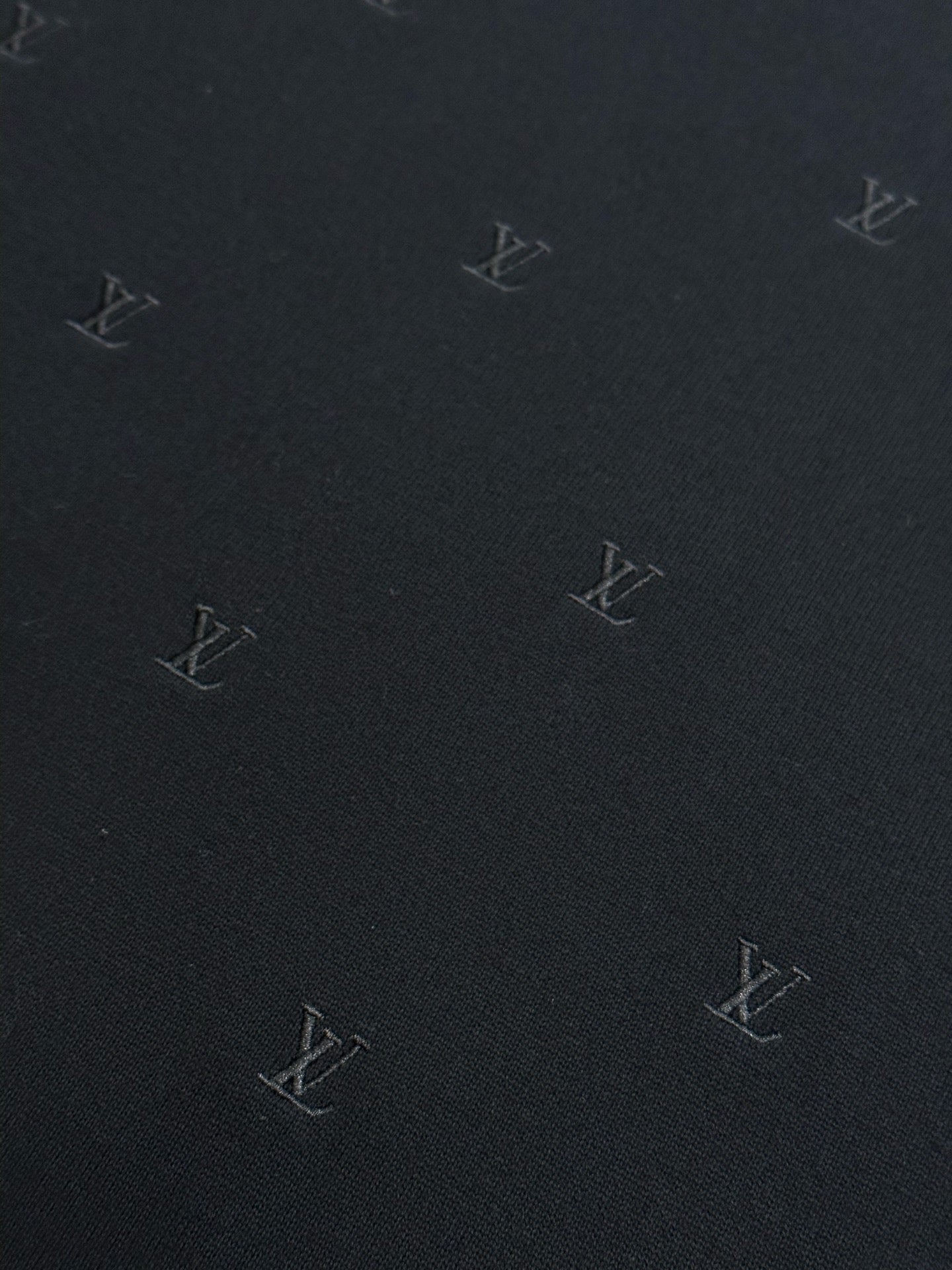 Louis Vuitton dark knit fabric with scattered monogram logos