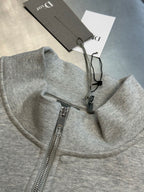 Light gray heather half-zip sweatshirt with front zipper and inner care tags