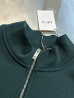 Teal Dior quarter-zip sweatshirt with ribbed collar, front zipper, and logo