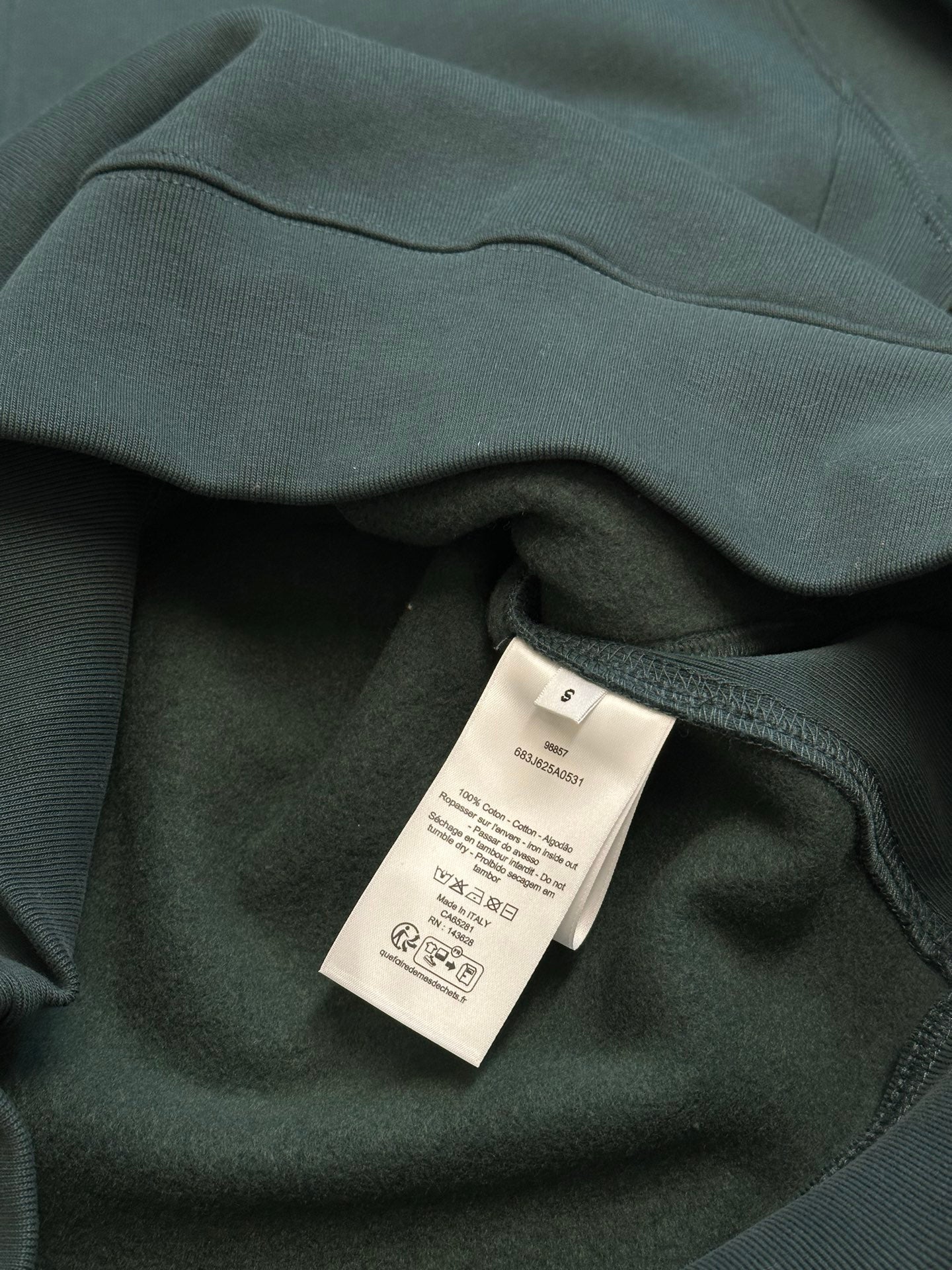 Teal Dior sweatshirt with internal care label on inner collar seam