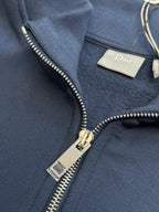 Dark blue Dior quarter-zip hoodie with metal zipper and Dior label tag