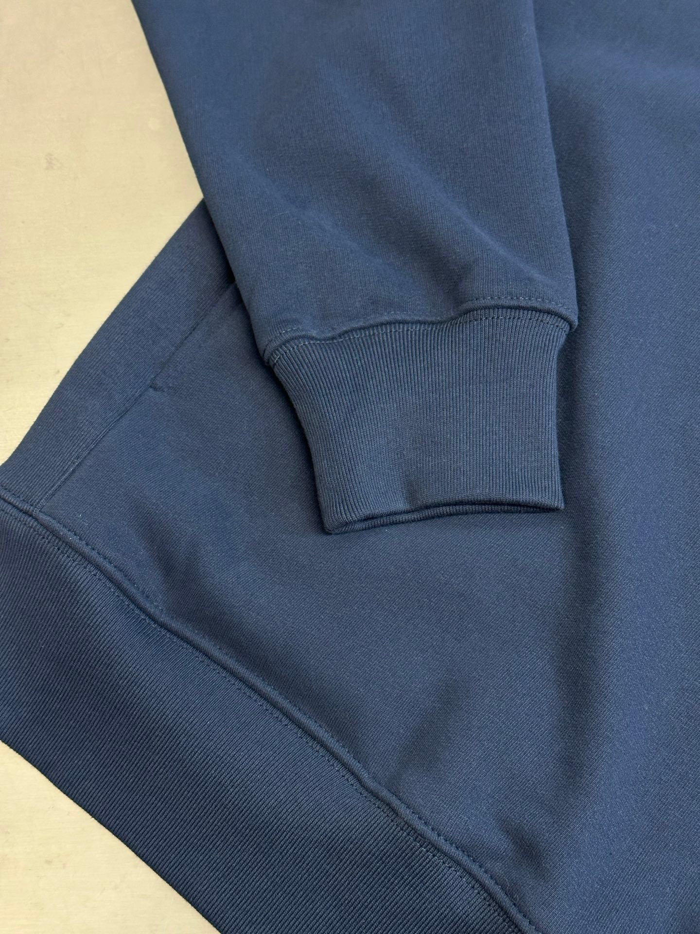 Dark blue Dior hoodie sleeve and hem with ribbed cuffs