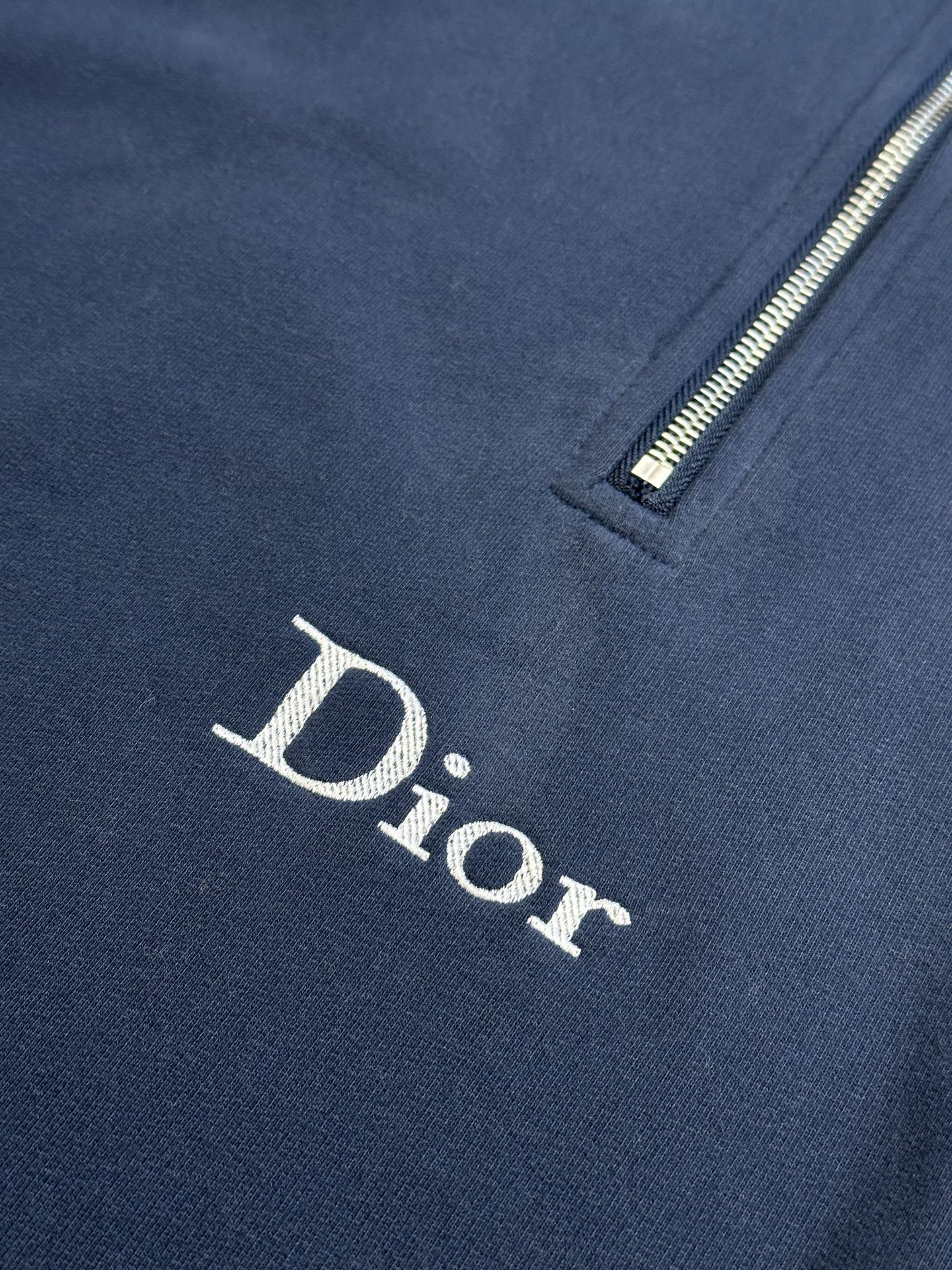 Dark blue Dior hoodie with embroidered Dior logo on front