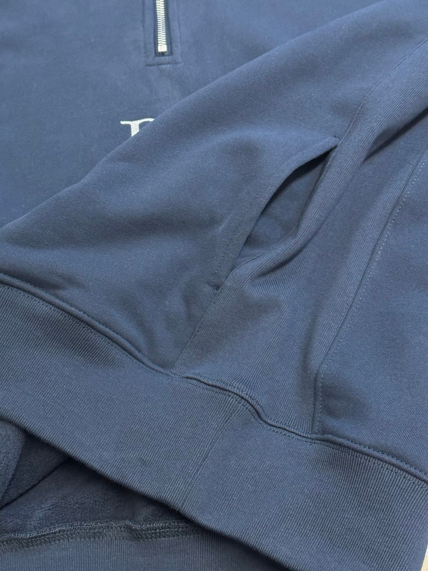 Dark blue Dior hoodie with quarter-zip placket and ribbed waistband detail