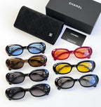 Assorted designer round glasses set with black, brown, red, yellow, and blue frames