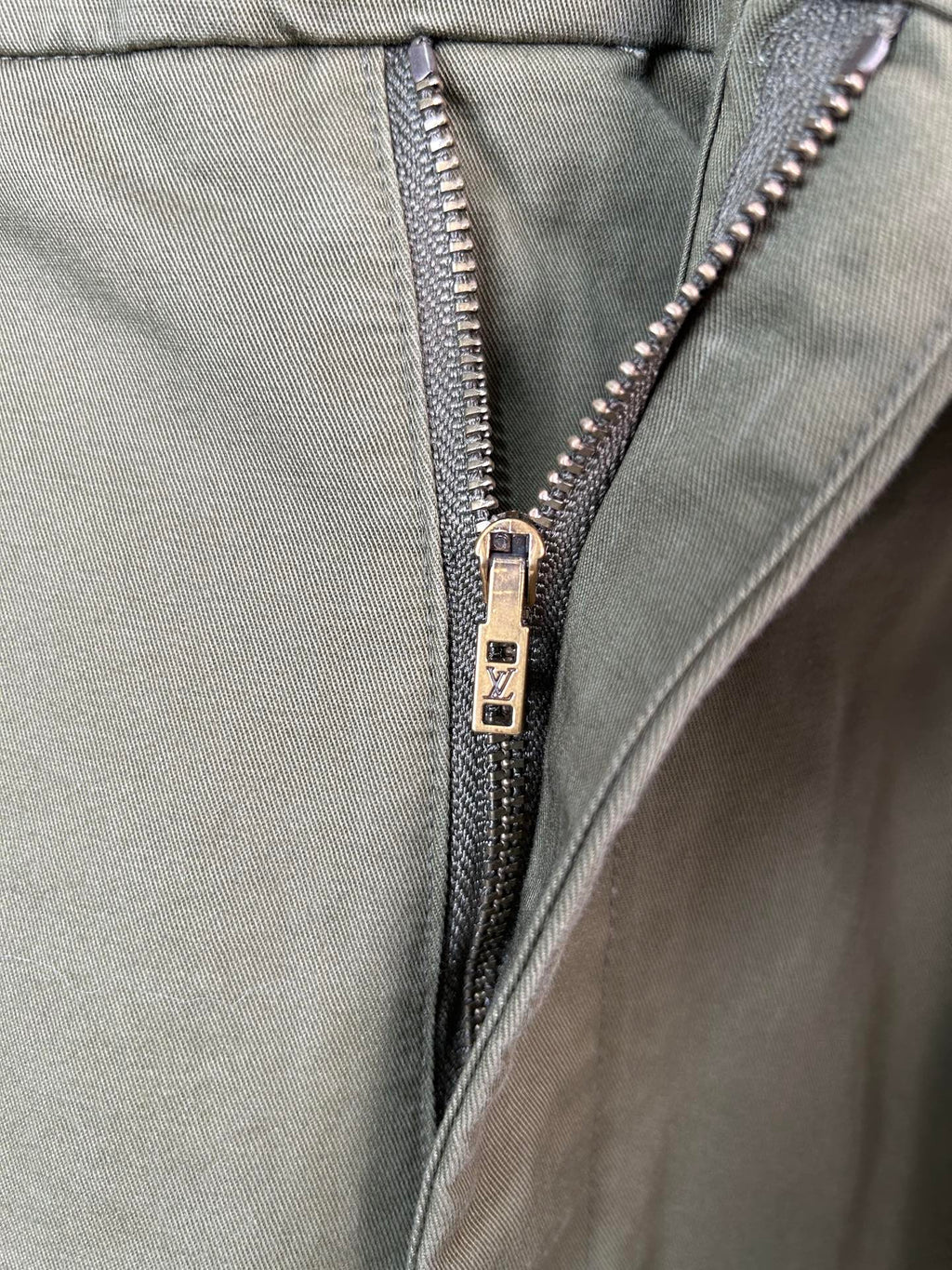 Olive pants with silver zipper and waistband button