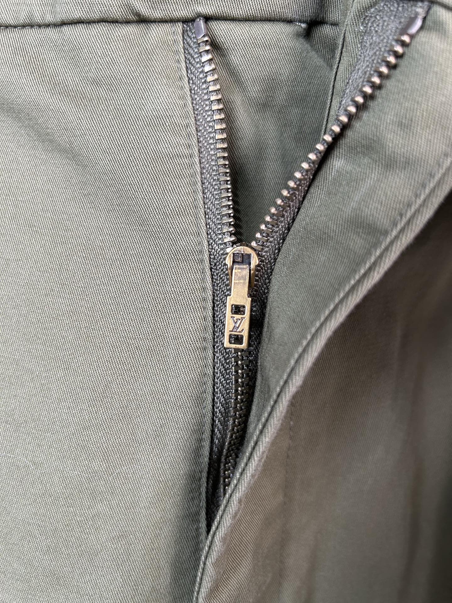 Olive pants with silver zipper and waistband button