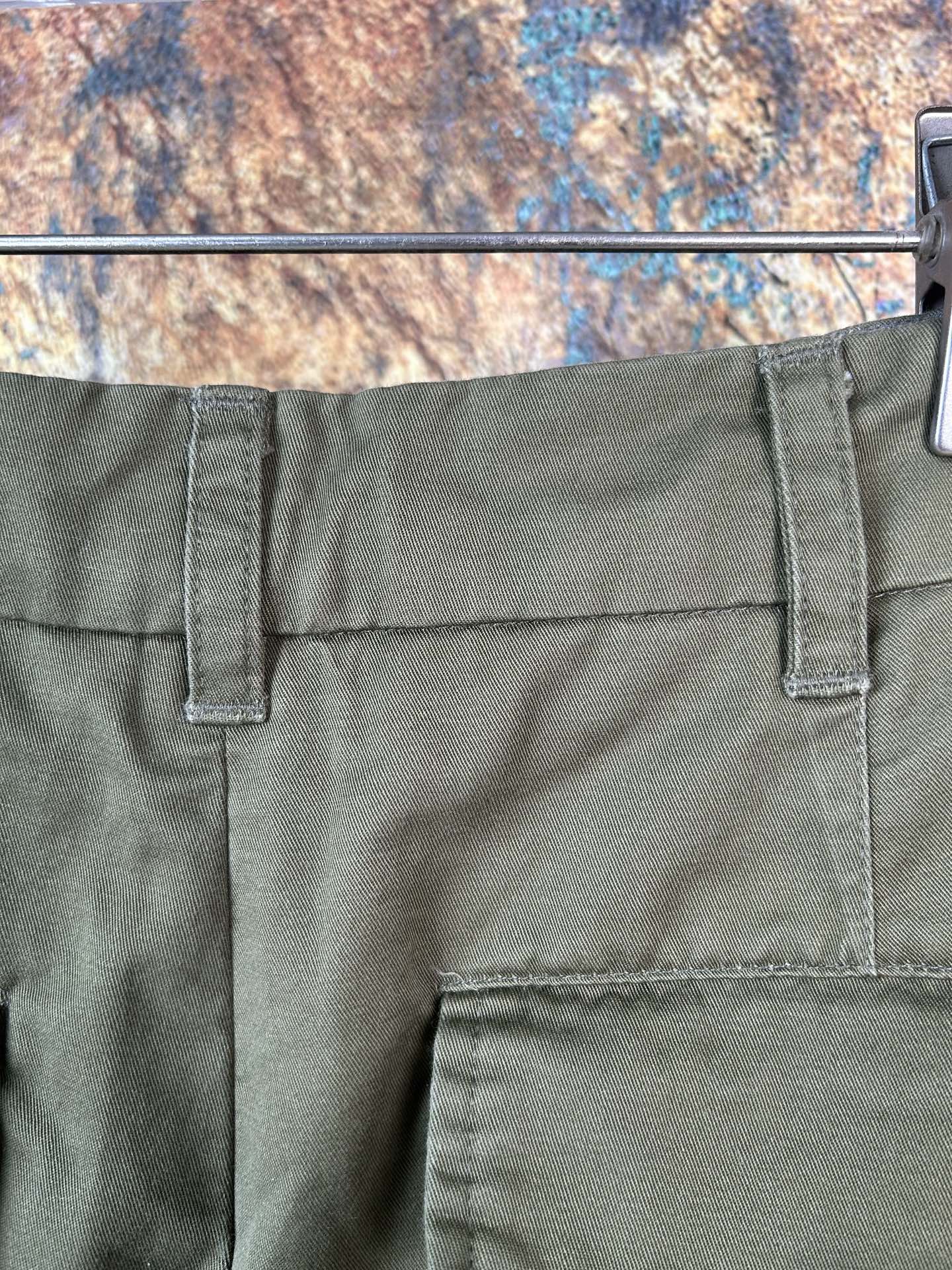 Olive pants back yoke with belt loops and stitched pocket panels