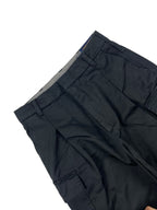 Dark cargo pants with pleated front and layered cargo pocket details