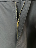 Black cargo pants with gold-tone zipper and button fly