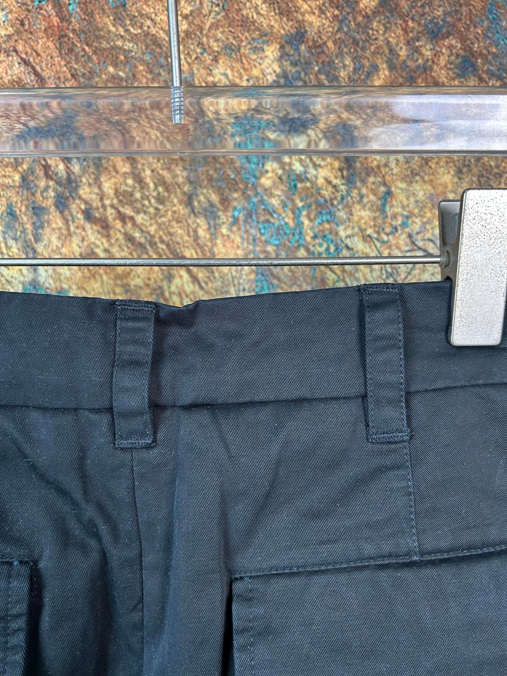 Black cargo pants with front button closure and belt loops