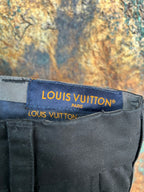 Black pants waistband label with Louis Vuitton text