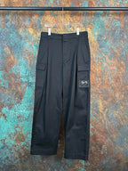 Black cargo pants with flap side pockets and adjustable waistband tabs
