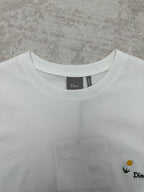 White crewneck T-shirt neckline detail with Dior label inside collar.