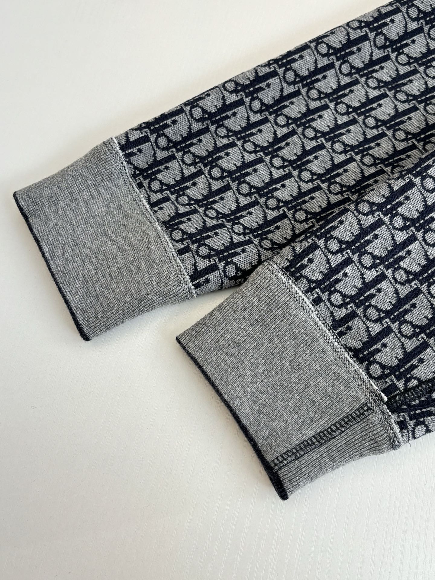 Dior long socks pair, gray cuffs with navy Dior-patterned knit fabric
