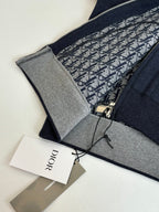 Dior hoodie close-up: patterned lining, zipper pull, and gray inner trim