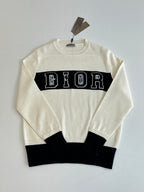 Dior crewneck sweater in cream with black lower band and DIOR logo