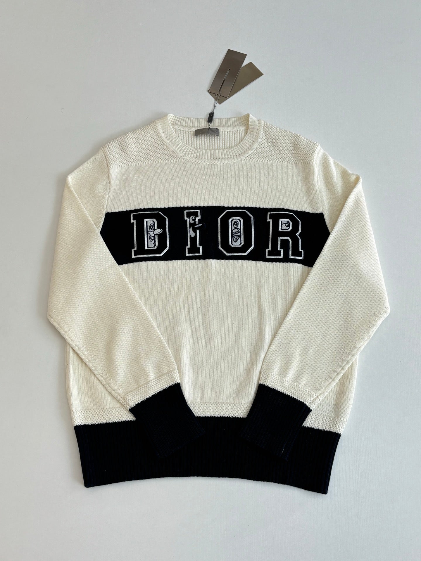 Dior crewneck sweater in cream with black lower band and DIOR logo