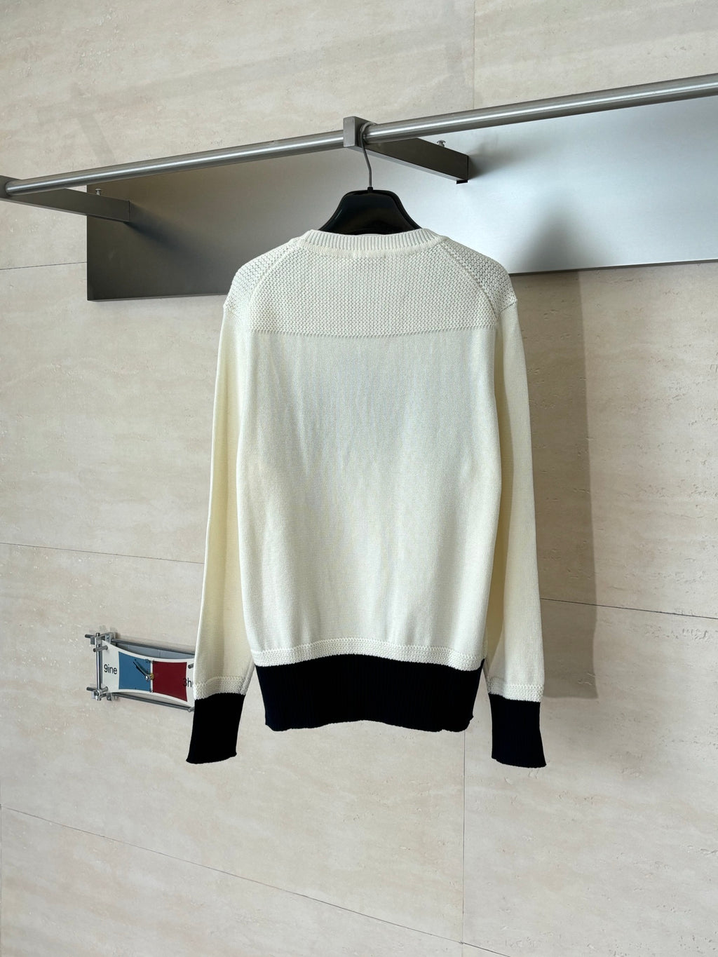 Dior crewneck sweater back view in cream with black ribbed hem and cuffs