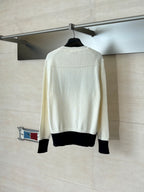 Dior crewneck sweater back view in cream with black ribbed hem and cuffs