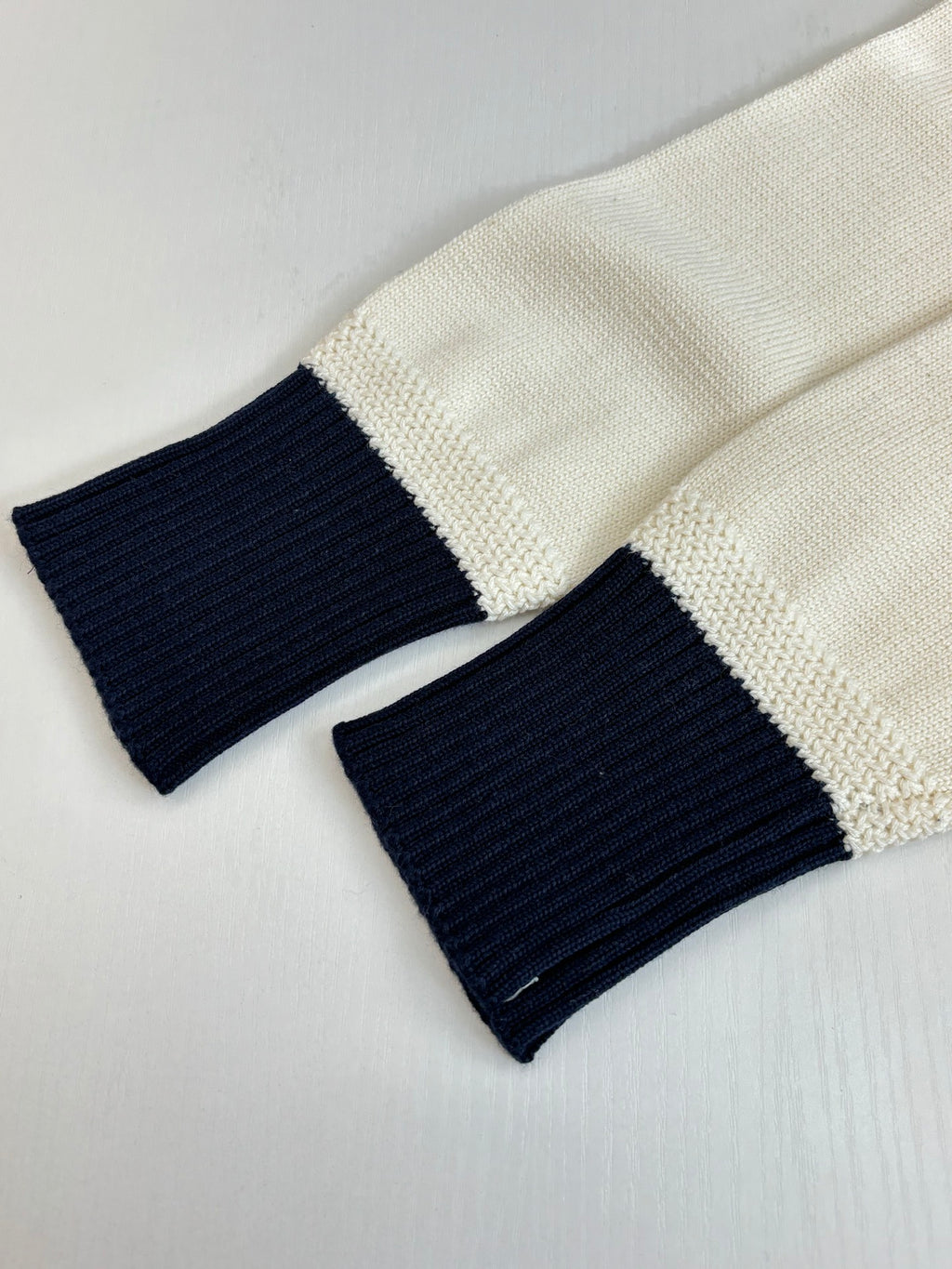 Dior sweater cuffs in cream knit with navy/black ribbed sections