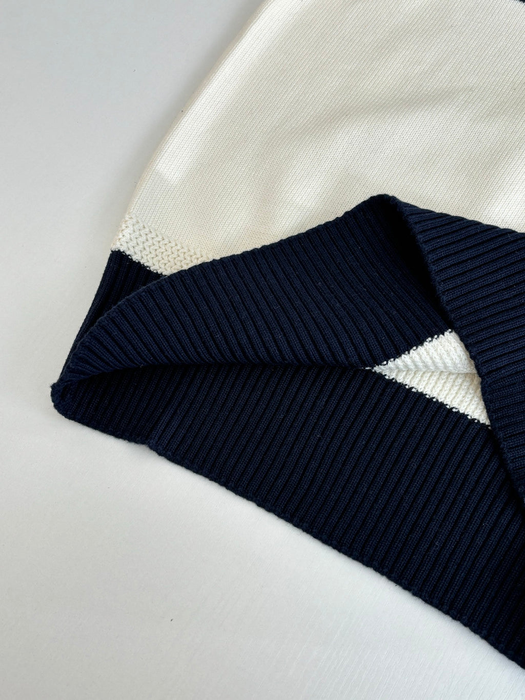 Dior colorblock sweater with cream knit and navy/black ribbed band