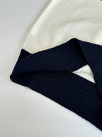 Dior colorblock sweater with cream knit and navy/black ribbed band
