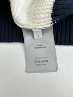 Dior sweater care label on cream-and-navy ribbed knit cuff